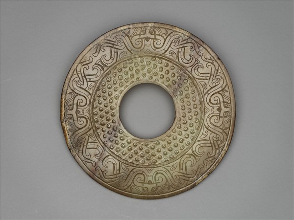 玉雙身獸紋璧（紋飾後加）