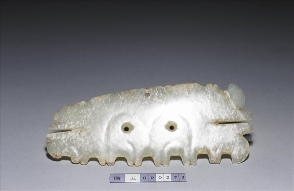 玉帶齒動物面紋飾片