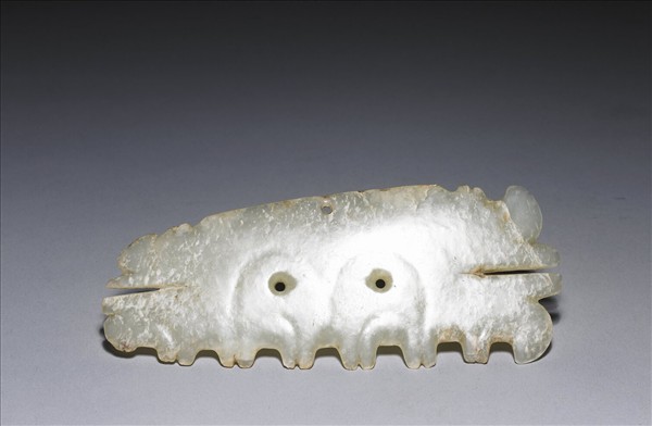 玉帶齒動物面紋飾片
