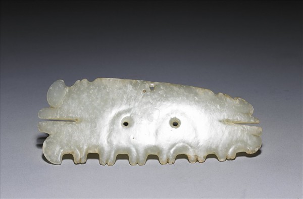 玉帶齒動物面紋飾片