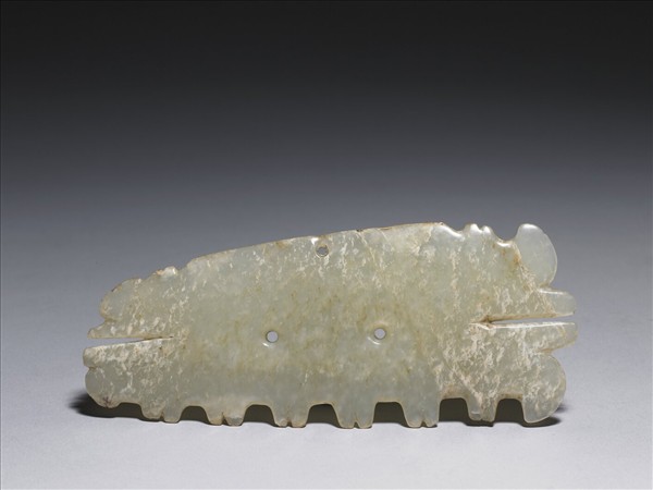 玉帶齒動物面紋飾片