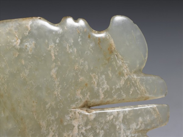 玉帶齒動物面紋飾片