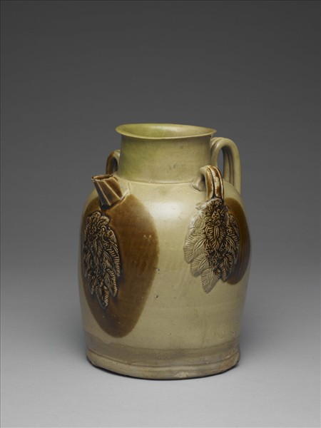 青釉貼花褐斑把壺