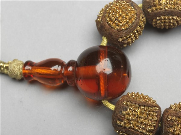 茄楠木嵌金團壽念珠