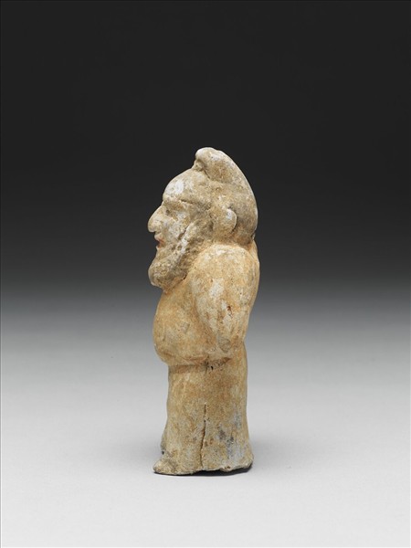 白釉加彩侏儒胡人陶俑