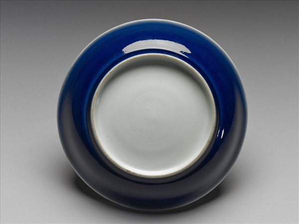 霽青釉白裡龍紋盤