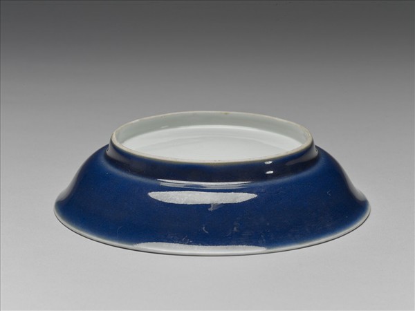 霽青釉白裡龍紋盤